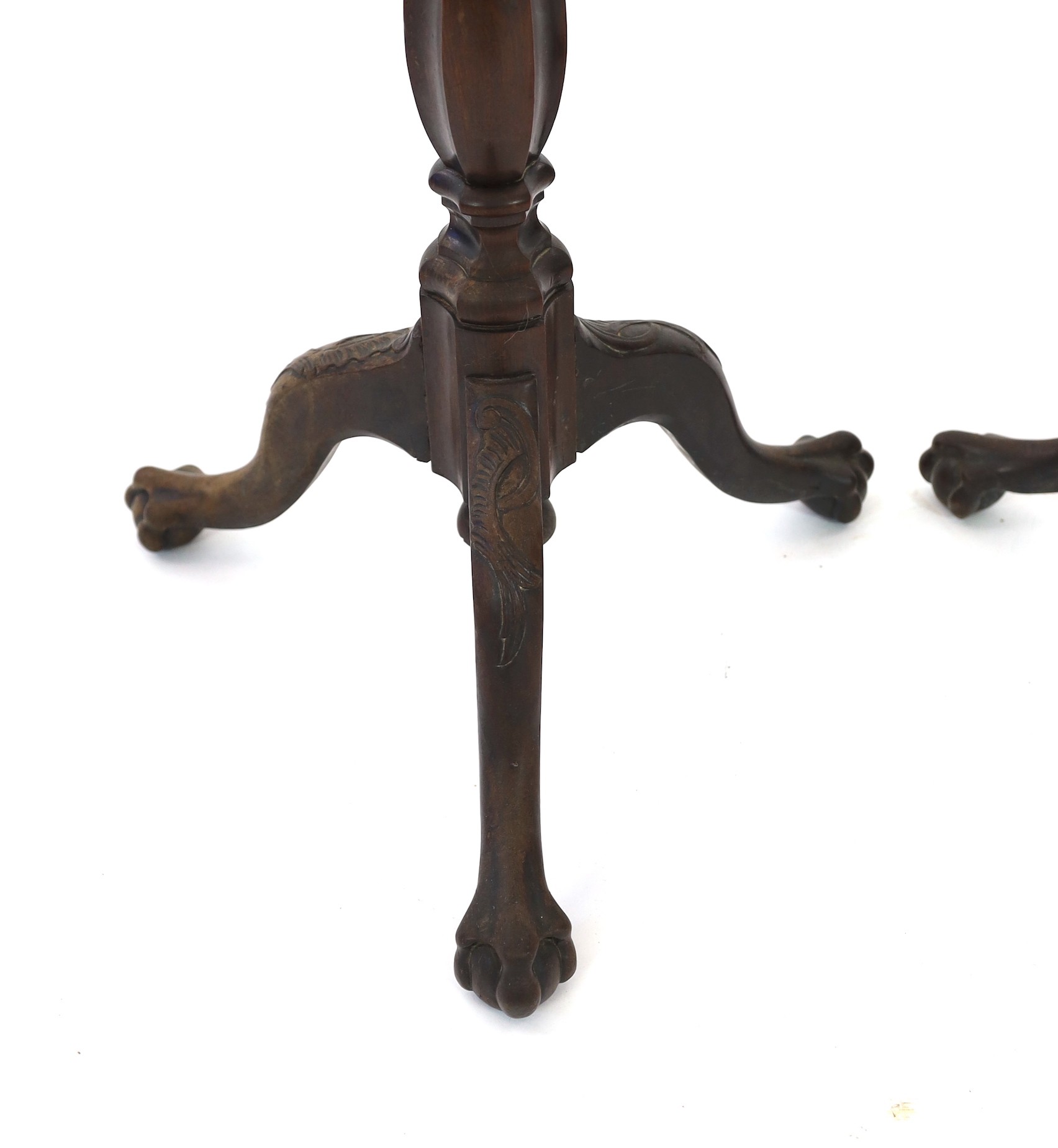 A pair of 18th century Dutch mahogany and oak torchere stands, width of tops 24cm height 69cm